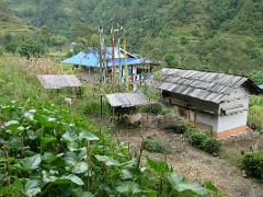 Kangchenjunga 09 02 Yamphudin House Outside The man who ran the campground at Omji Khola (2340m) recommended we stay at his house in Yamphudin (1690m). Here it is from the outside with very tall Buddhist&hellip;
